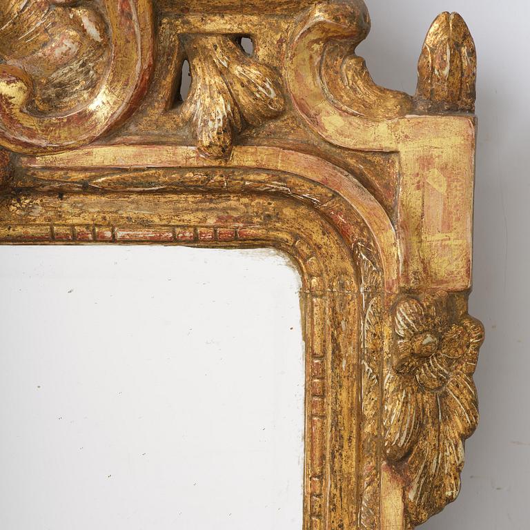 A Swedish rococo giltwood mirror, Stockholm, later part 18th century.