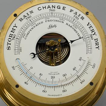 A brass barometer and clock, Schatz, 20th century.