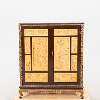 A Chinese wooden cabinet  mid 1900s.