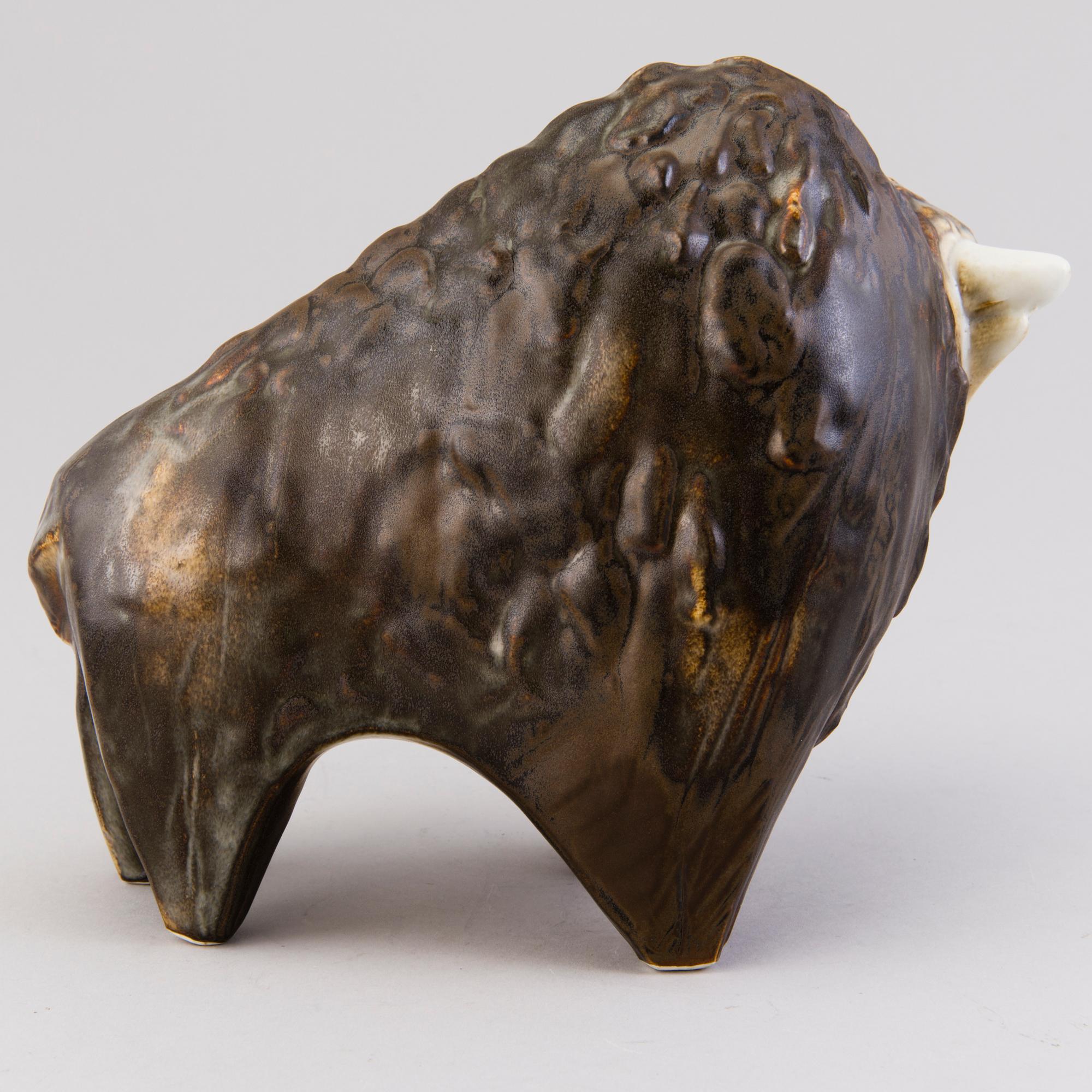 A Ceramic Figurine, signed T Kaasinen Arabia Finland.