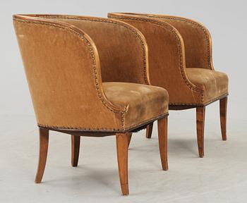 A pair of Nordiska Kompaniet 'Bellman' elm armchairs attributed to Axel Einar Hjorth, Sweden 1929-30.