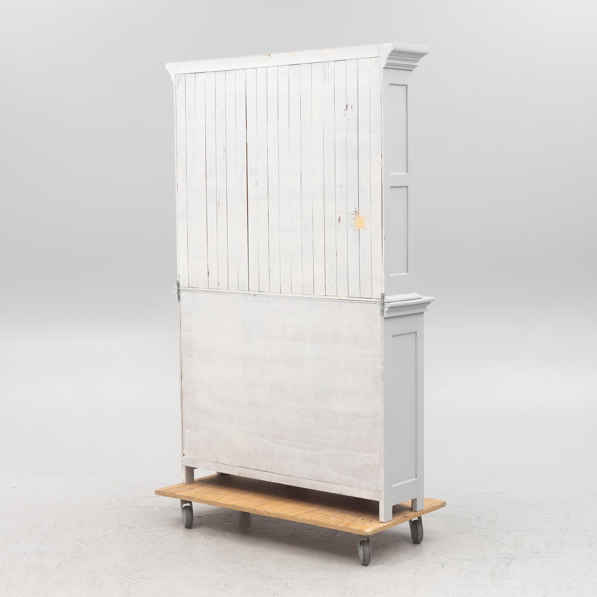 A display cabinet, 20th Century.