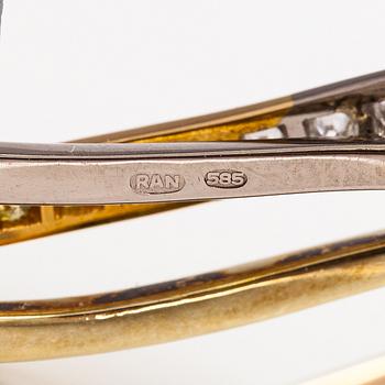 Raimo Nieminen, Brosch "Valonkukka", 18K gult. grönt och vitt guld, diamanter ca 1.40 cy och skuren lapis lazuli. 2005.