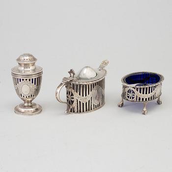 A mustard pot, a pepper pot, a salt cellar, silver, London, England, early 20th century. Weigth ca 412 grams.