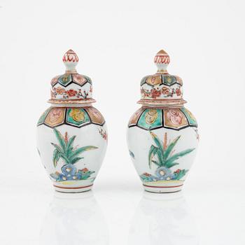 A pair of Japanese jars with covers, circa 1900.