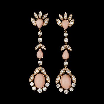 1131. A pair of angel-skin coral and diamond earrings. Total carat weight of diamonds circa 3.90 cts.