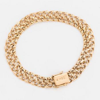 A BRACELET in 18K gold.