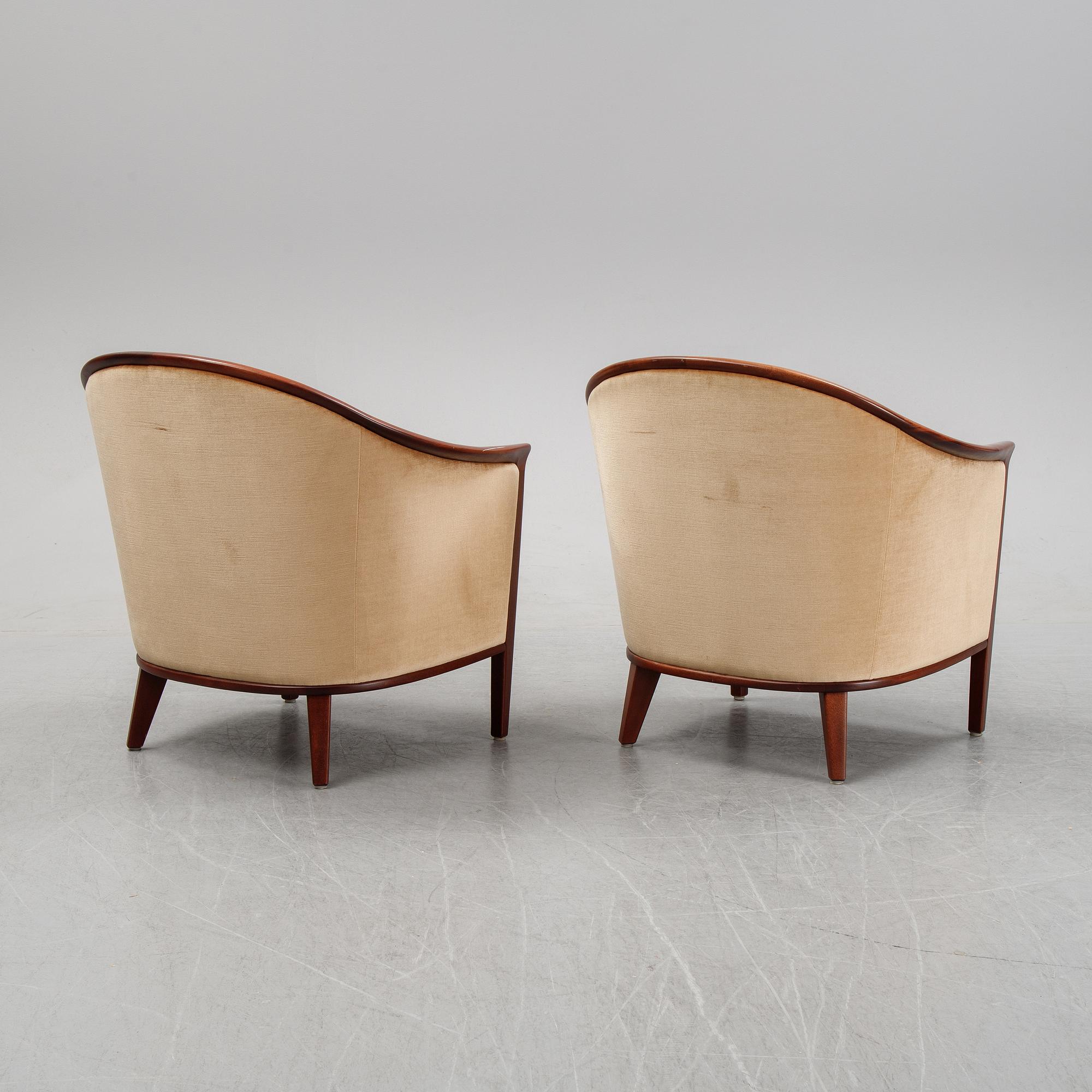 A pair of mahogany and velvet easy chairs by Bröderna Andersson, 1960's.