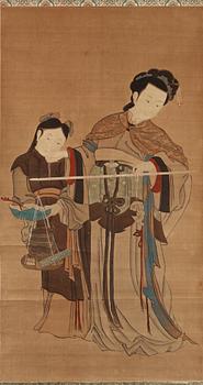 134. A hanging scroll of a lady and maid with a scaler, in the style of Qiu Ying (c 1494-1551) late Qing dynasty (1644-1912).