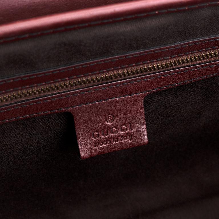 Gucci, a monogram canvas bag.