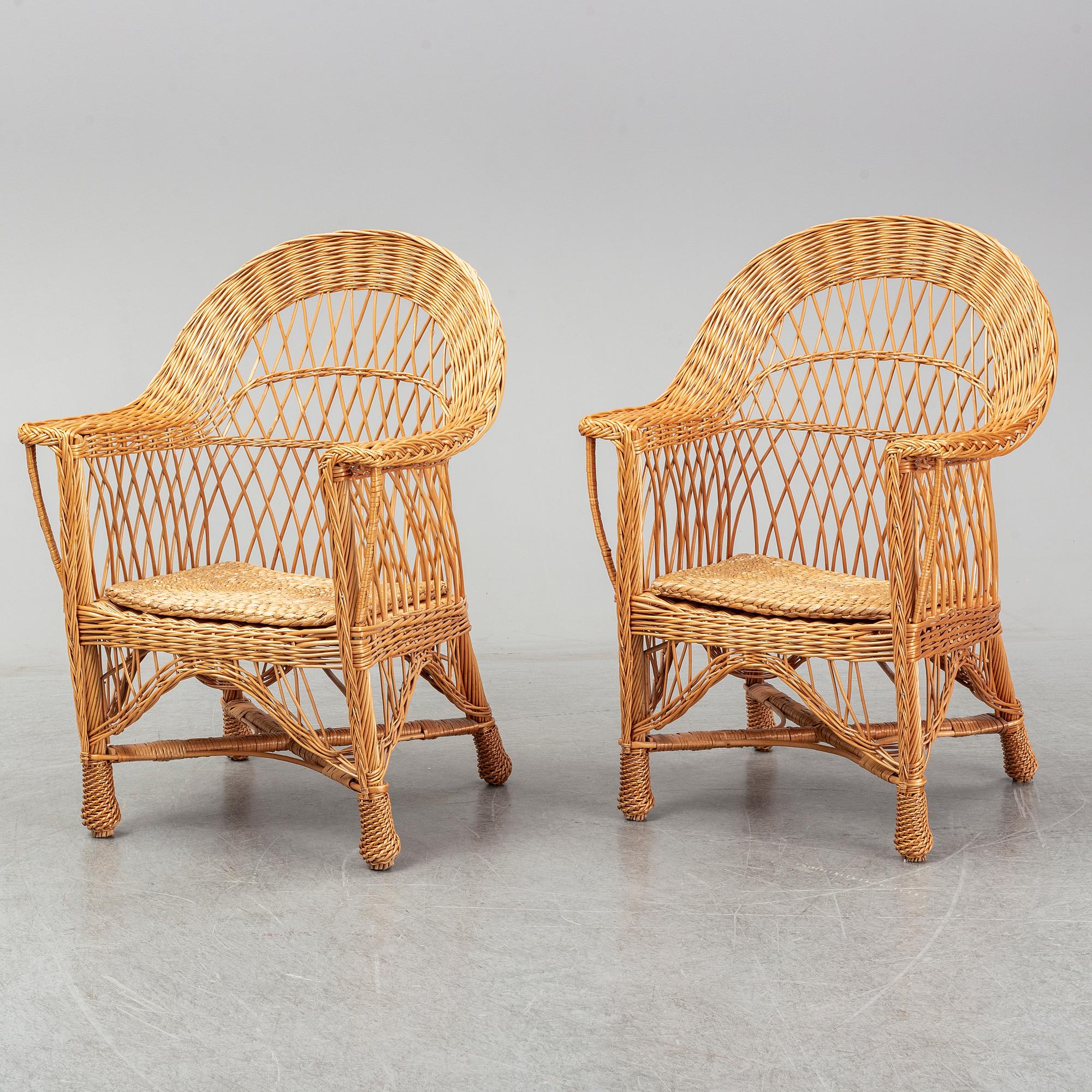 A pair of 1970s/1980s rattan armchairs.