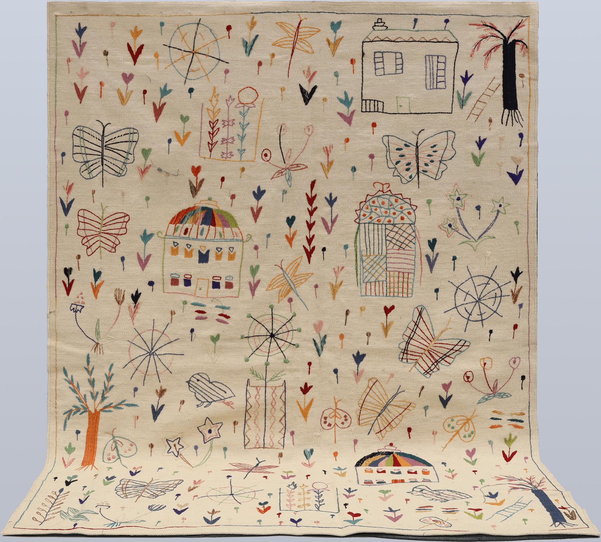 A hand-embroidered Kilim rug, approx. 244 x 180 cm.