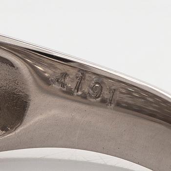 A platinum bombé ring with brilliant-cut diamonds.