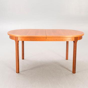 A Nils Jonsson teak and walnut 1960s dining table.