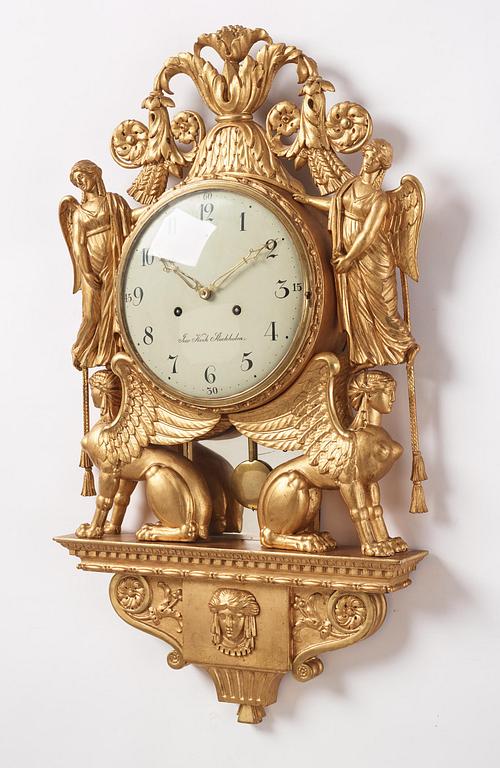 A late Gustavian giltwood cartel clock by J. Kock (royal watchmaker, active 1762-1803).