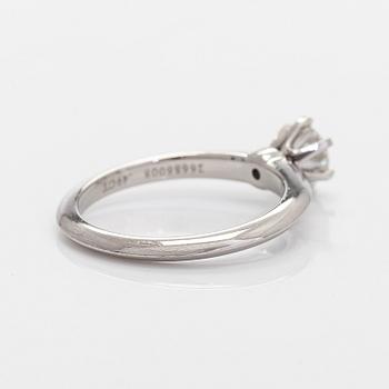 Tiffany & Co, a platinum solitaire ring with a brilliant-cut diamond.