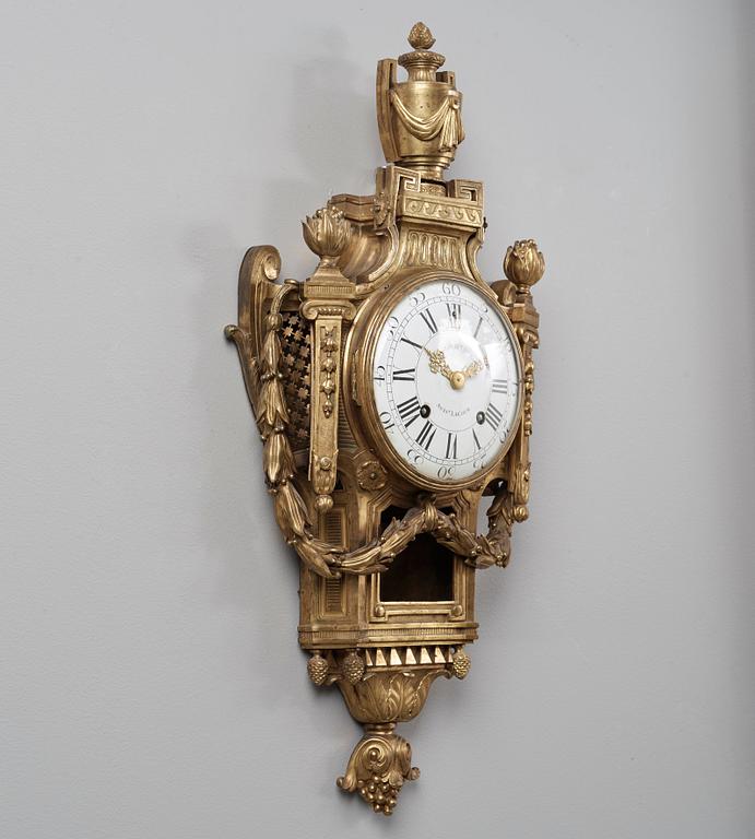 A Louis XVI late 18th century gilt bronze wall clock.