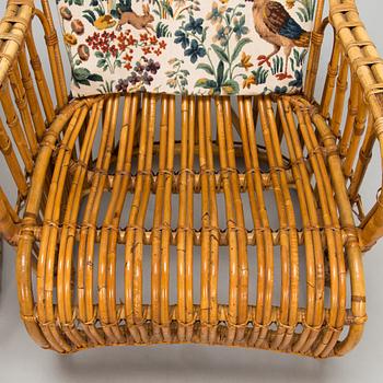 A pair of mid-20th-century rattan armchairs.