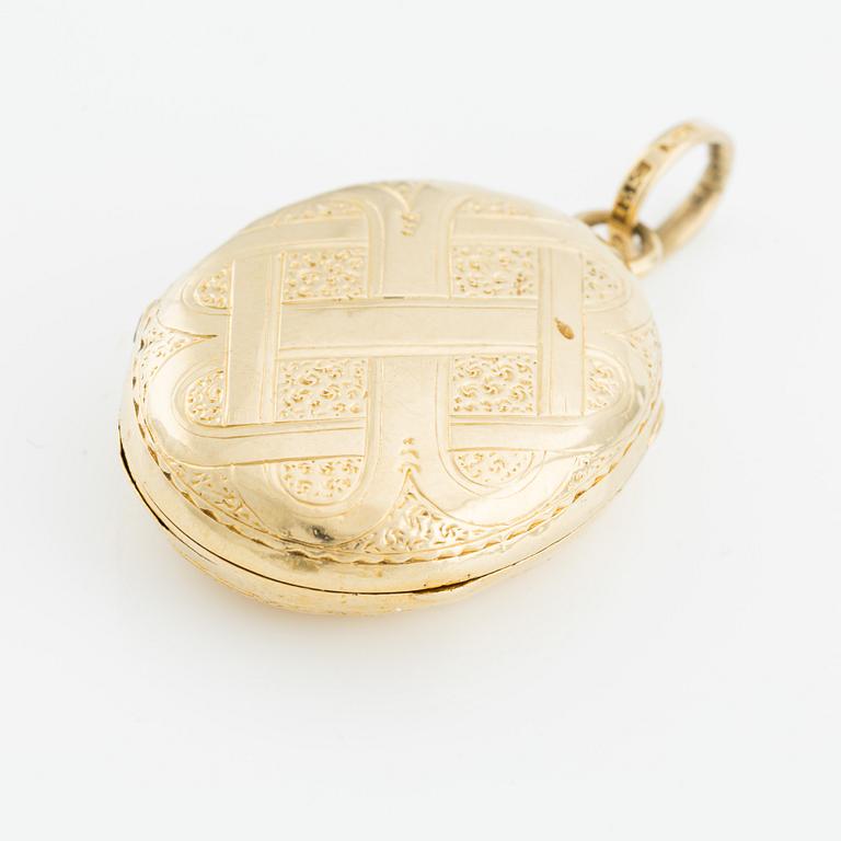 Medaljong/Fotogömma, 18K guld.