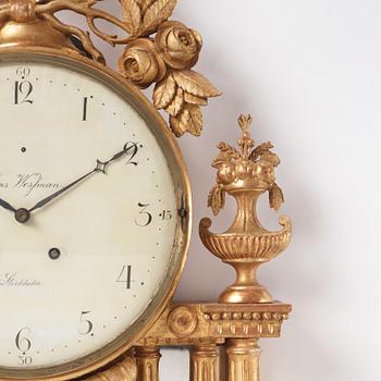 A Gustavian giltwood cartel clock by H. Wessman (watchmaker in Stockholm 1787-1805).