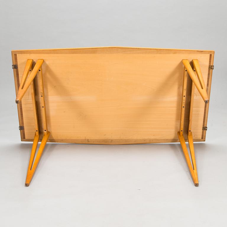 A mid-20th century dining table.