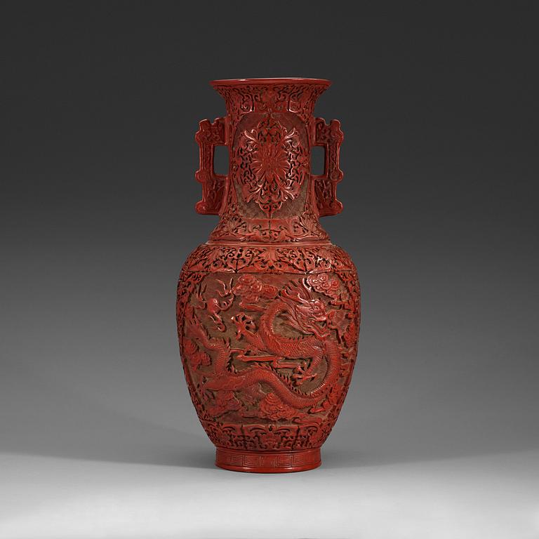 A lacquer vase, late Qing Dynasty (1644-1912) with Qianlong mark.