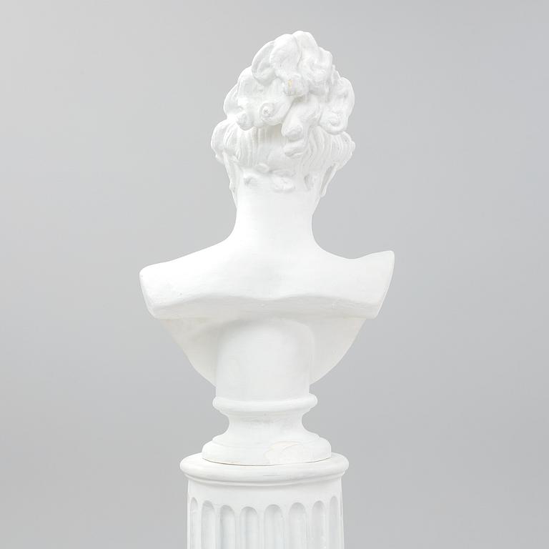 A plaster bust and pedestal.
