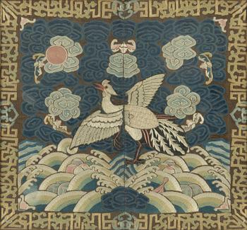 An embroidered civil official's rank badge with a bird, 'buzi', Qing dynasty.