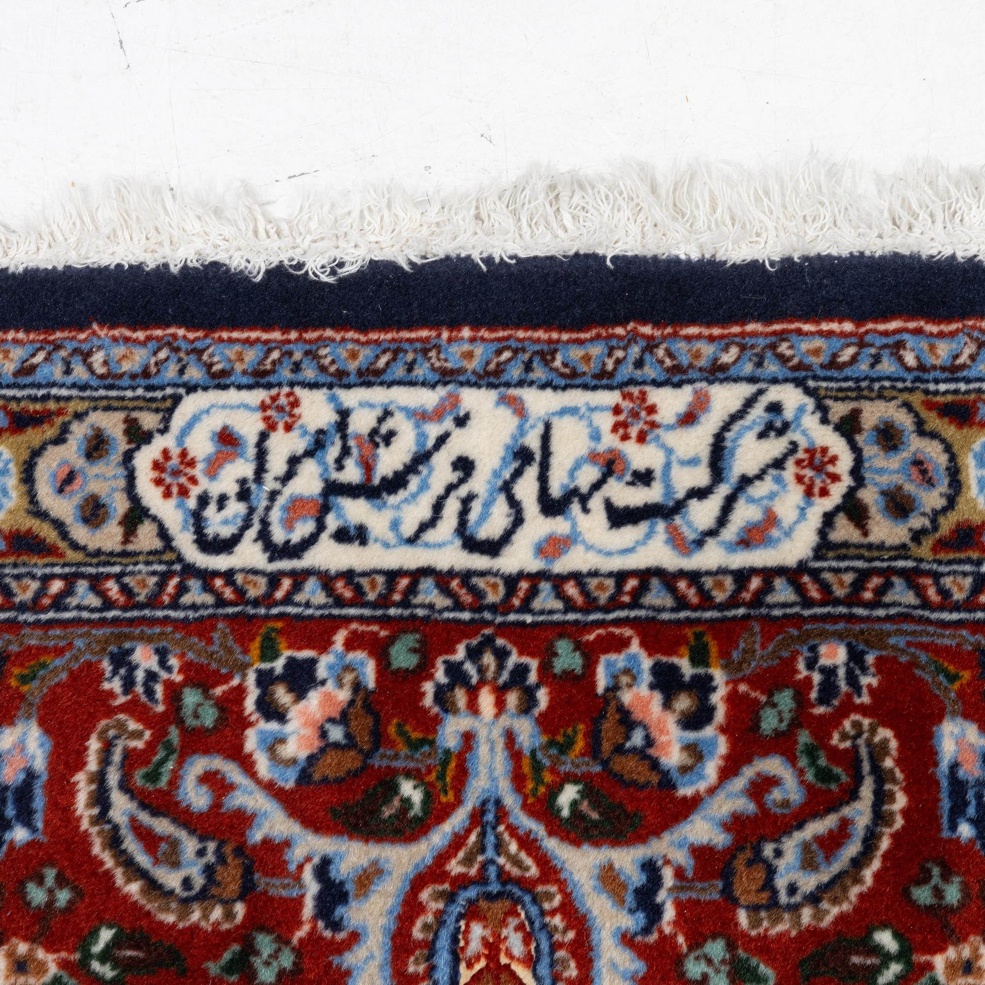 A Moud carpet, part silk, signed, c. 345 x 249 cm.