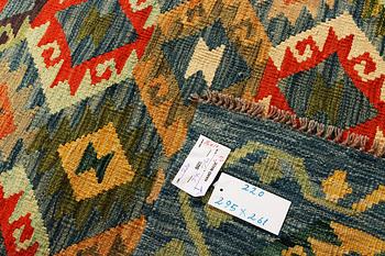 A Kilim carpet, c. 295 x 261 cm.