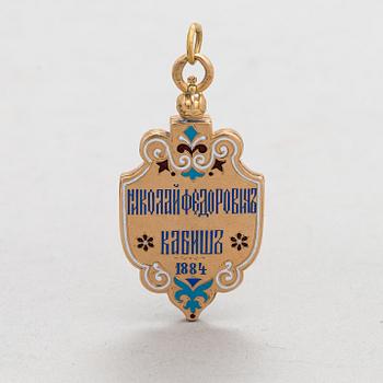 A 14K gold and enamel jetton. Moskow.