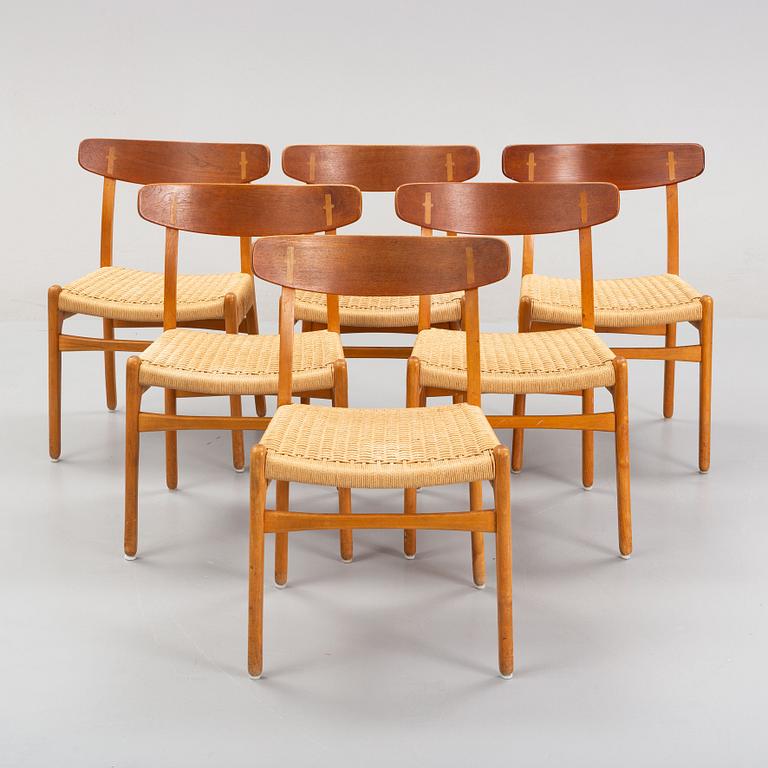 Hans J Wegner, a set of six beech and teak model CH-23 chairs, Denmark.