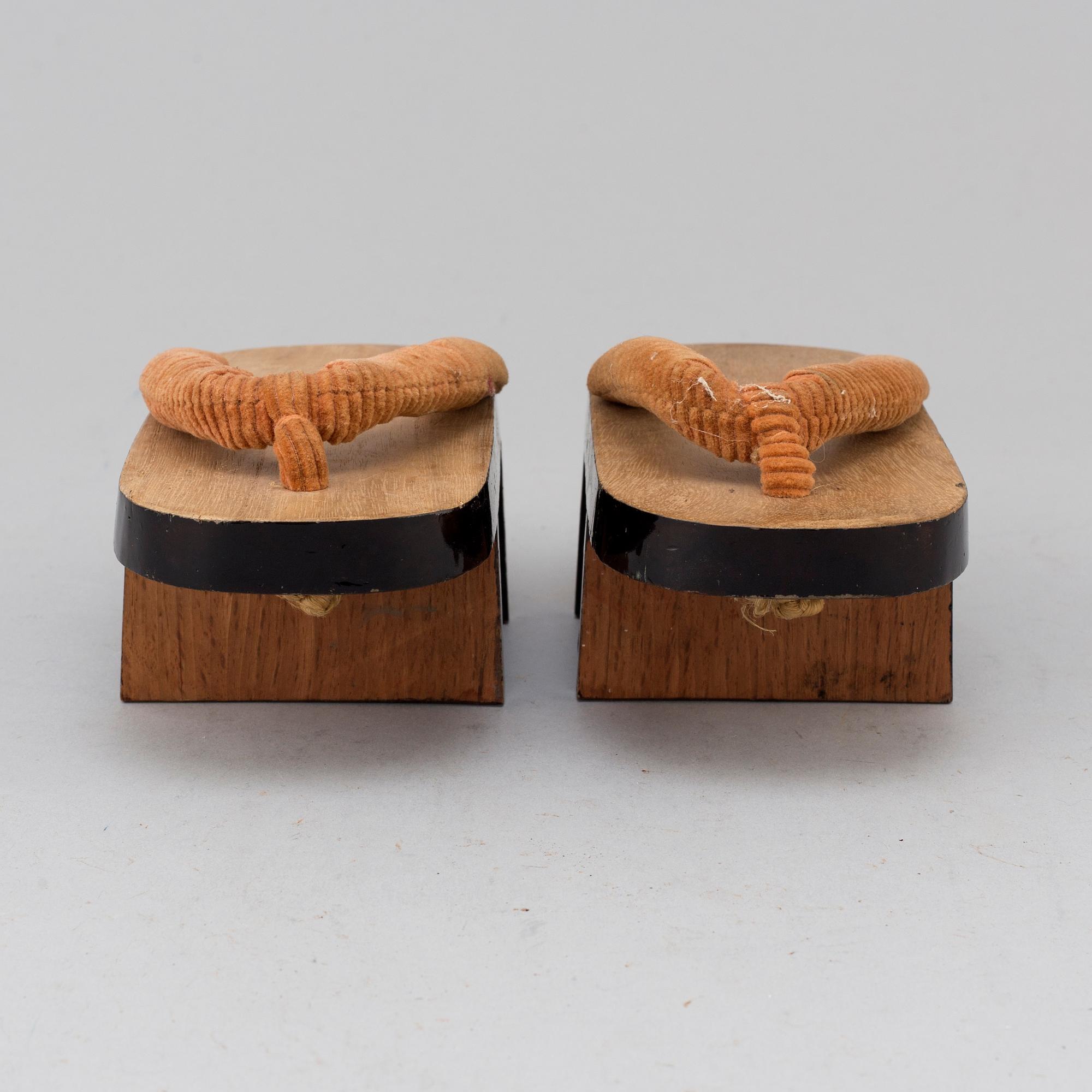 A pair of Japanese 'Geta' shows and two Chinese pouches, early 20th century.