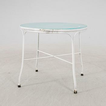 A tabe and two chairs from Byarum later part of the 20th century.
