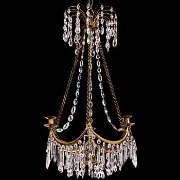 126. A Gustavian gilt brass and cut glass four-light chandelier, Stockholm, late 18th century.