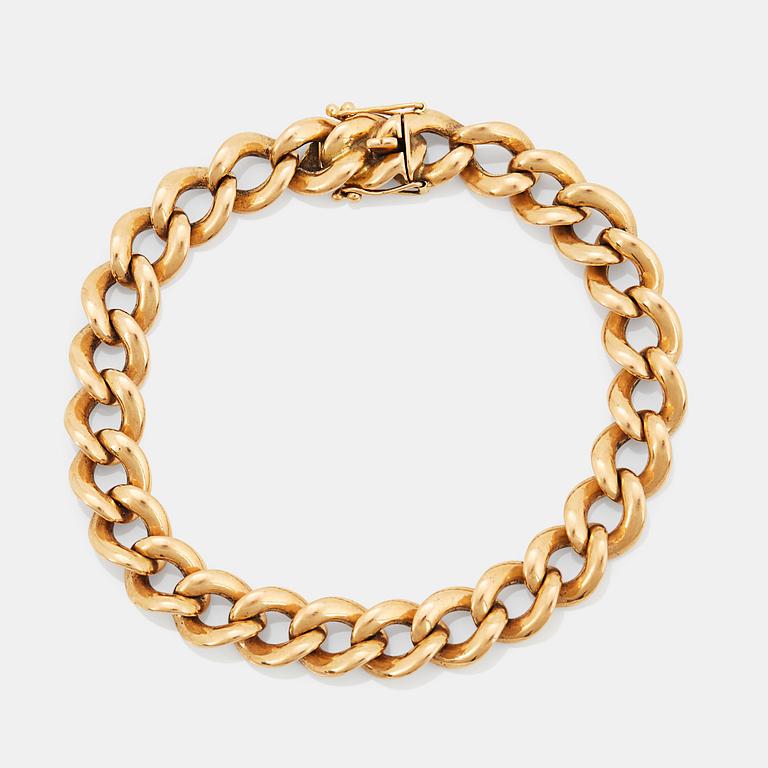 An 18K gold bracelet.