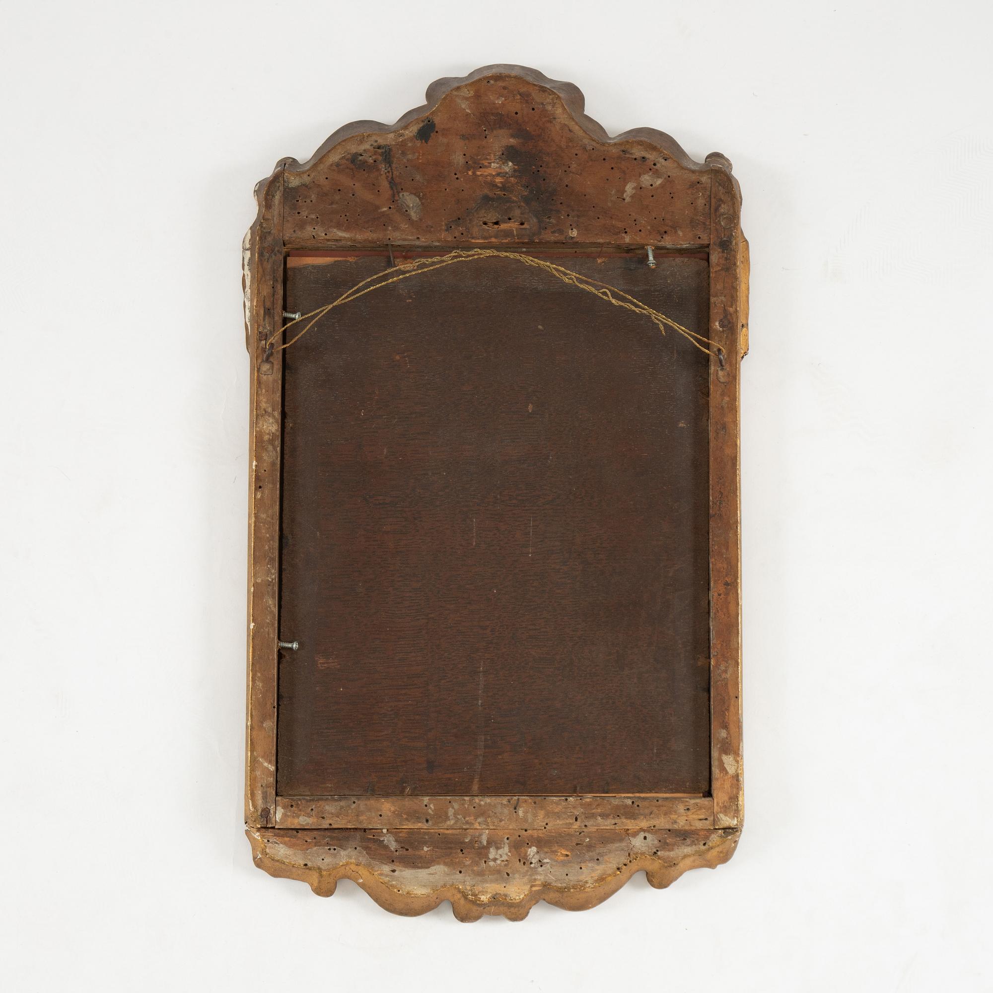 A Swedish rococo giltwood mirror, later part 18th century.