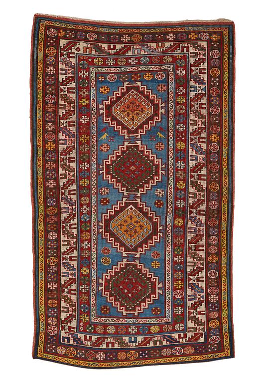 A RUG, a semi-antique Gendje probably, ca 209 x 124 cm.