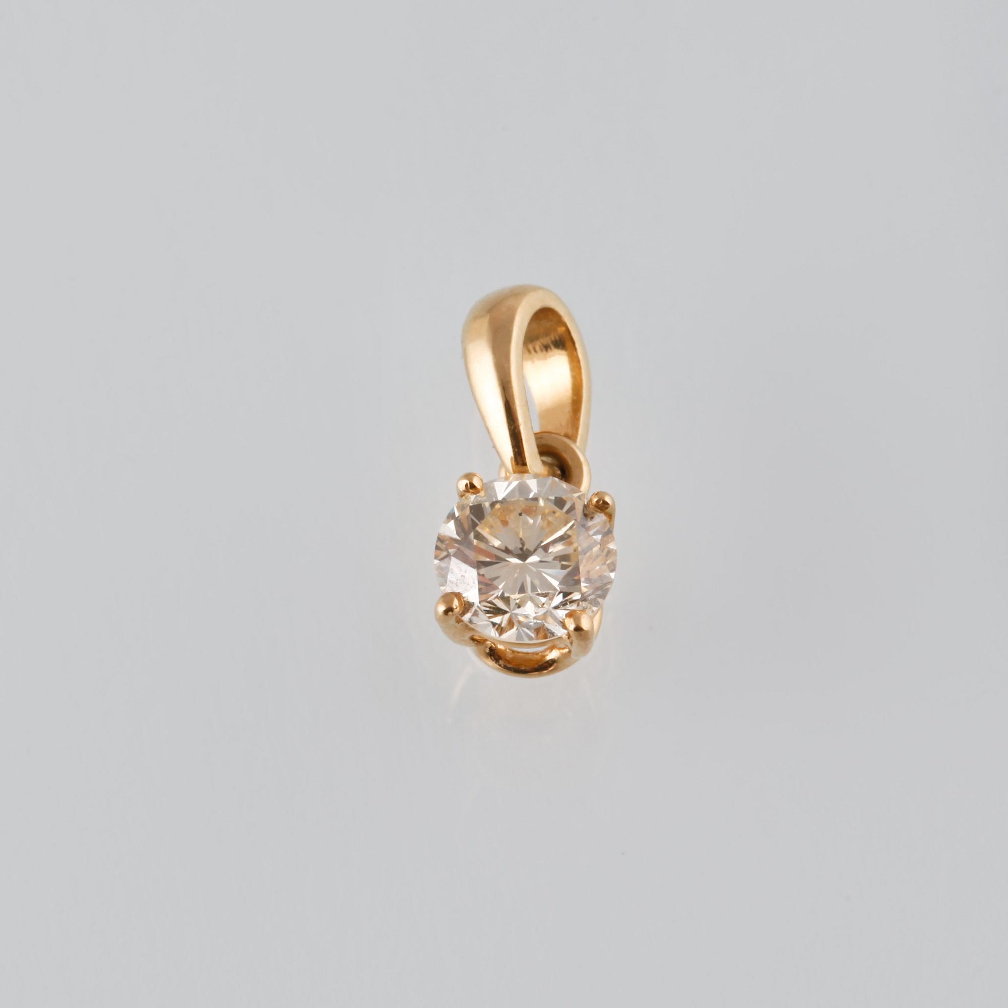 HÄNGE, 18K guld med briljantslipad diamant 0.50 ct. Vikt 0,6 gram.