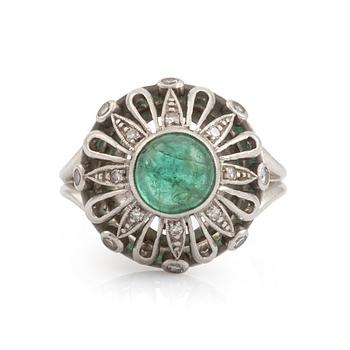 514. An A Tillander ring set with a cabochon-cut emerald.