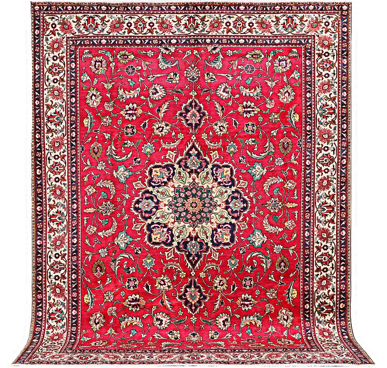 An oriental carpet, c. 385 x 300 cm.