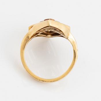 An Ilias Lalaounis ring in 18K gold set with eight-cut diamonds.