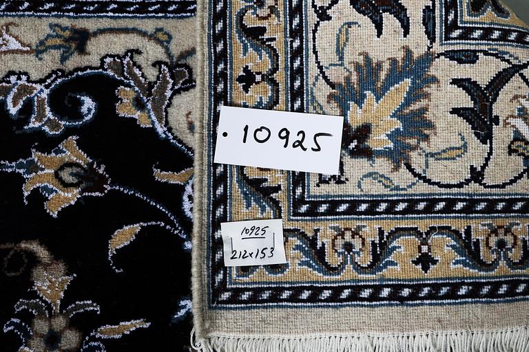 A carpet, Nain, part silk, ca 212 x 153 cm.