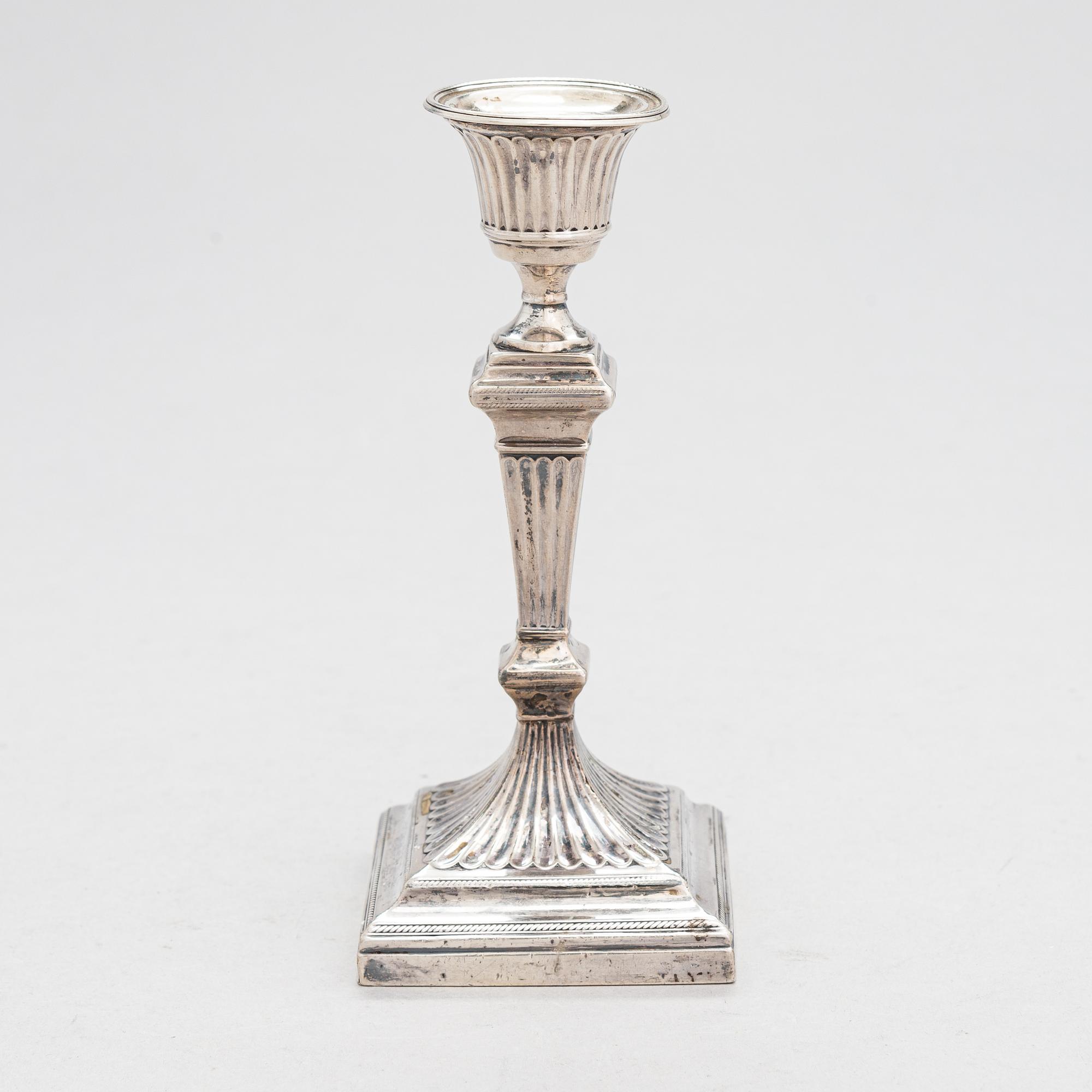 A late 19th-century sterling silver candlestick, maker's mark of William Hutton & Sons, London 1893.