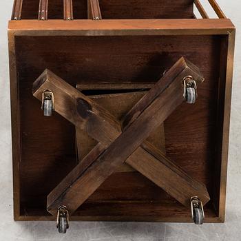 A swivel bookshelf veneered with mahogany from the second half of the 20th century.