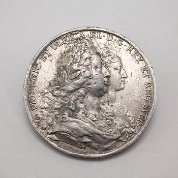 Two pewter medallions, 18th century.