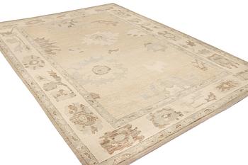 An Ushak design carpet, c. 442 x 317 cm.