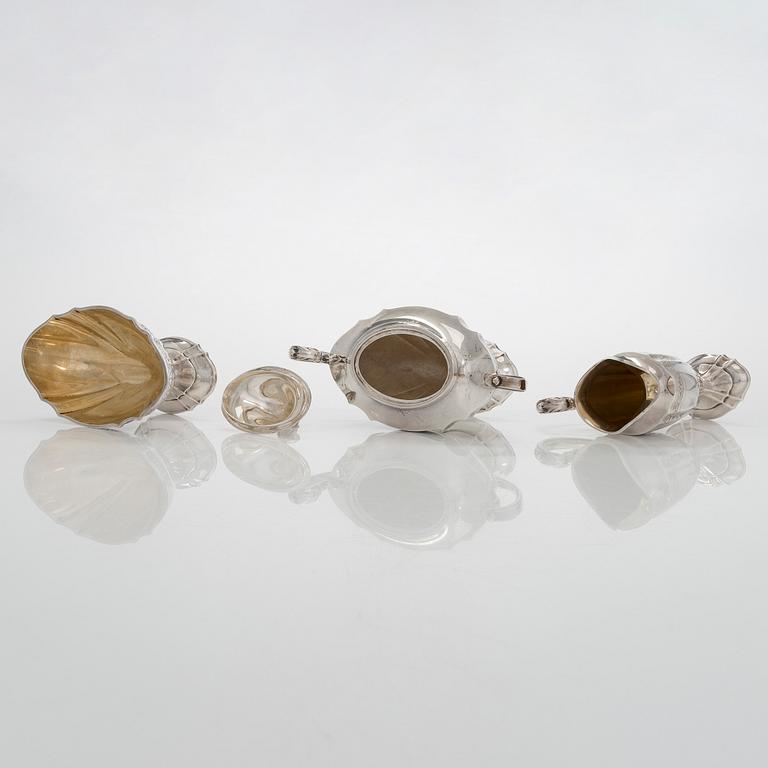 A five-piece sterling silver coffee and tea service, and 12 spoons, USA, first quarter of the 20th century.