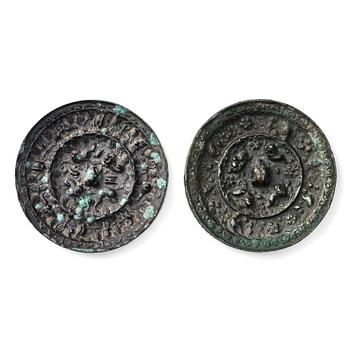 Two bronze mirrors with mythical animals, Tang dynasty (618–907). The pierced central knop surrounded by fruits and  mythica...