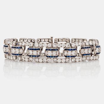 646. An Art Deco step cut sapphire and  old- cut diamond bracelet.